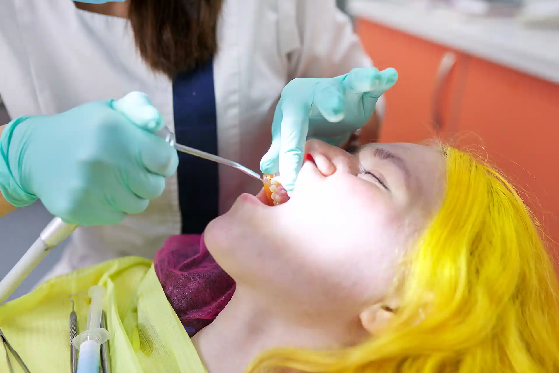 dental exam with professional tools