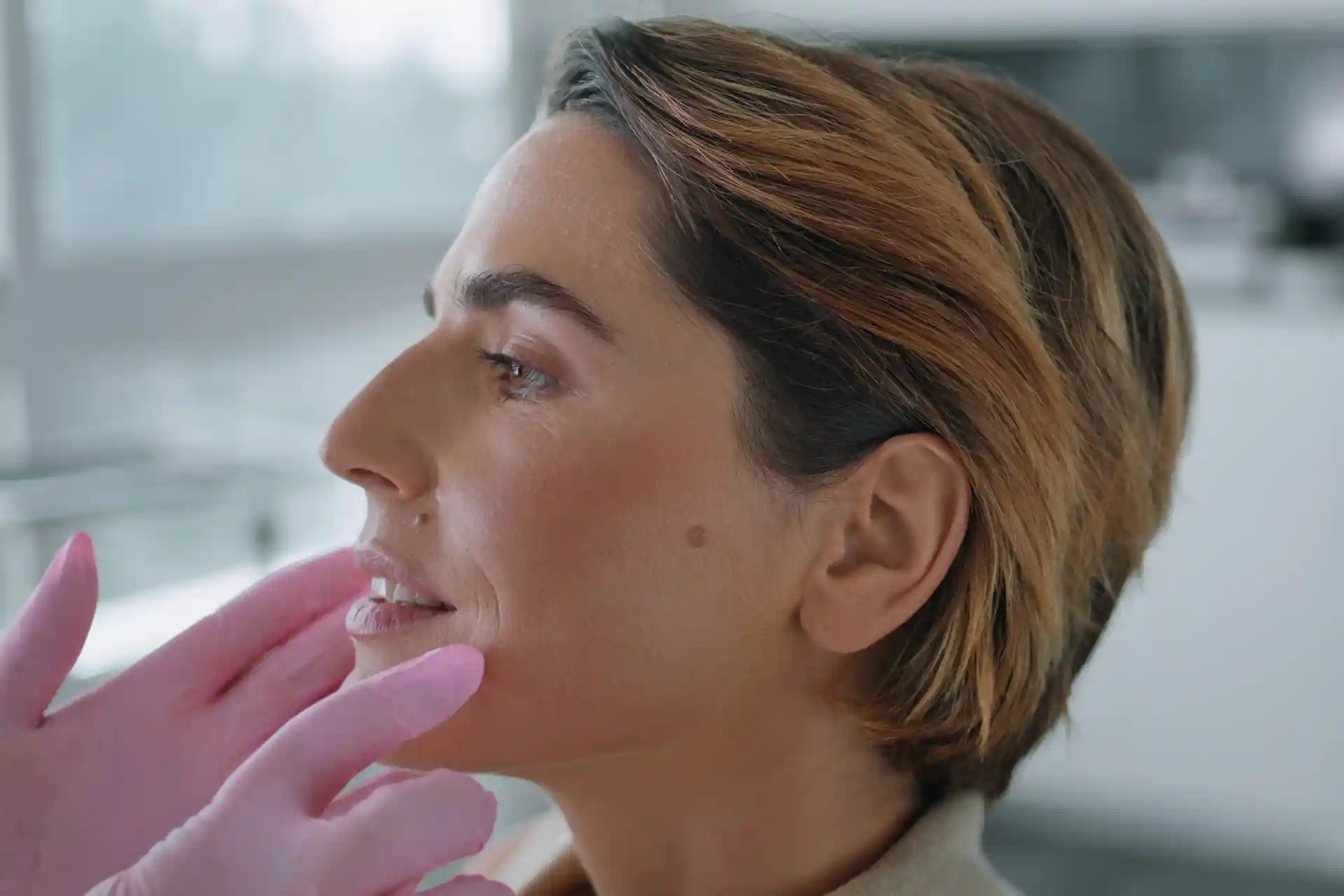 woman receiving facial procedure